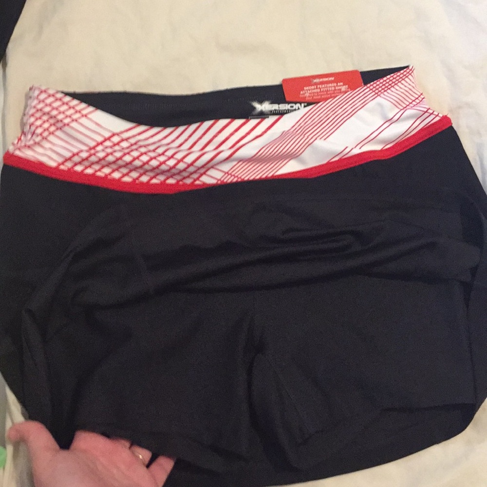 Black skort with red and white detail
